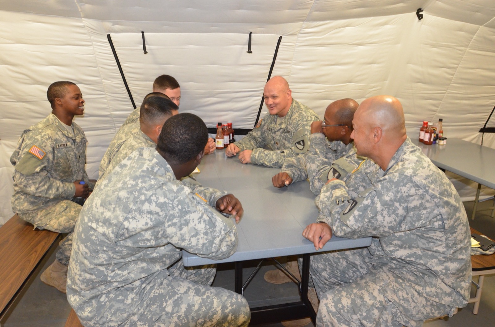 Two veterans sitting together in a supportive conversation.